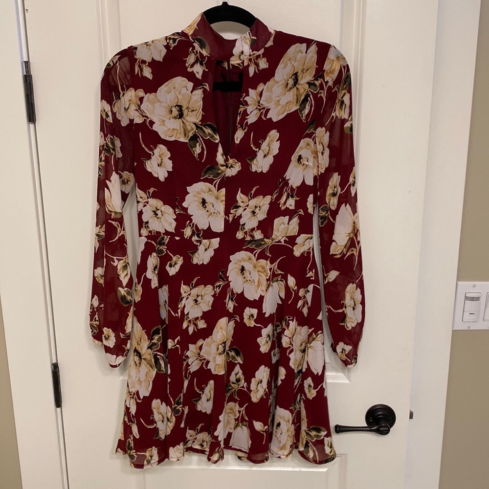 Red floral dress with sheer sleeves. Very great condition. Fabric is very light
